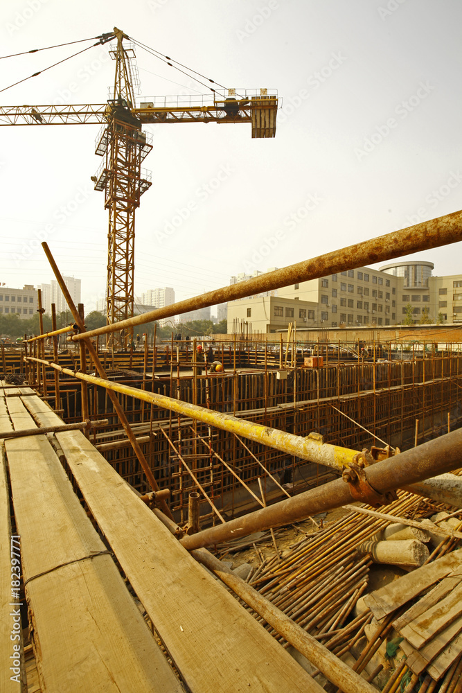 Naklejka premium worker in the construction site making reinforcement metal framework for concrete pouring