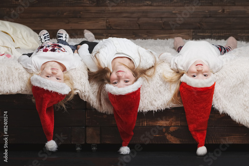 cute happy children with santa hats