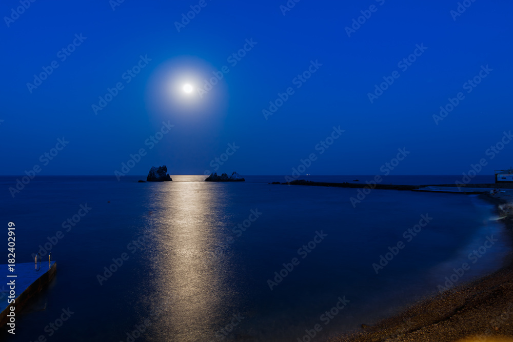 Fototapeta premium Camel rocks and three sisters at night/ view of the rocks Camel and three sisters at night, in the light of the moon, Southern coast of Crimea