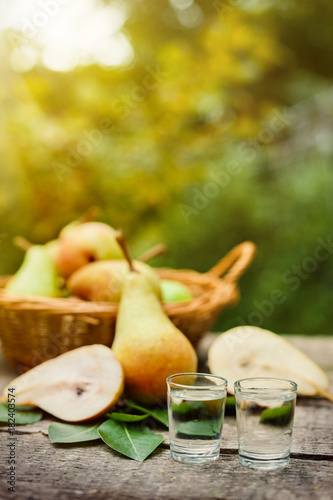 Shot glass with fruit brandy and pear