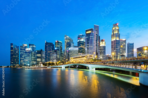 Singapore business district skyline in the evening. Marina Bay, Singapore. © tanarch