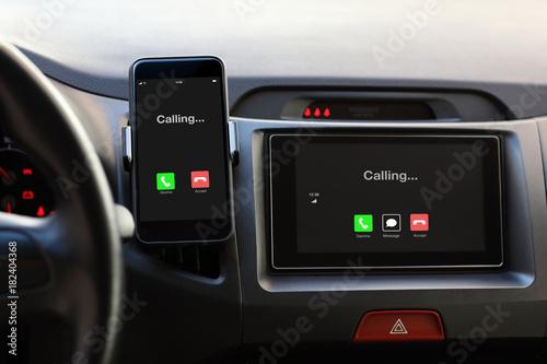 Phone and multimedia system phone calling on screen in car.