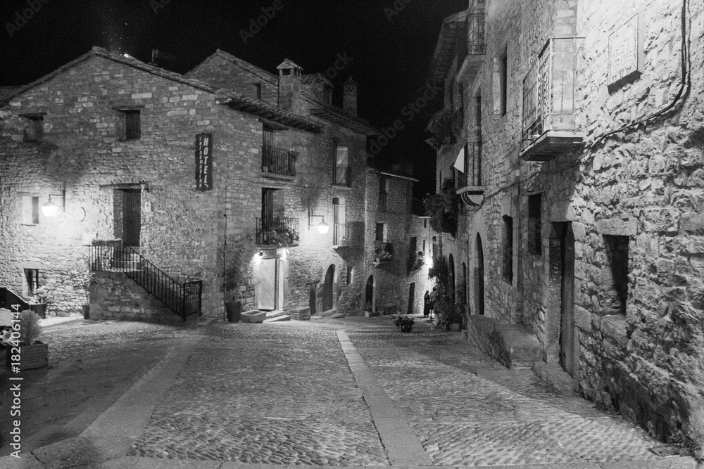 Ainsa medieval village of the Pyrenees with beautiful stone houses at night, Huesca, Spain