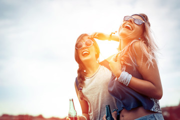 Happy friends laughing and having fun outdoors