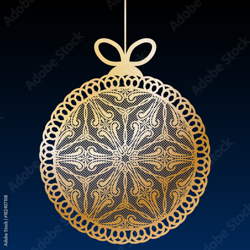 Decorative golden lace Christmas ball toy on dark blue background