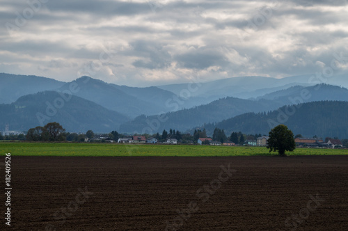 The farmlands of the Mur river valley and the mountains in the background