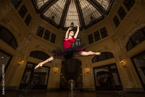 Ballerina Natalia Horsnell doing a split jump in the Oktogon public urban passageway in Zagreb, Croatia.