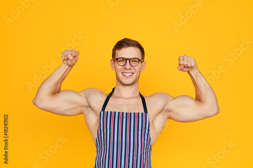 Muscular man in apron