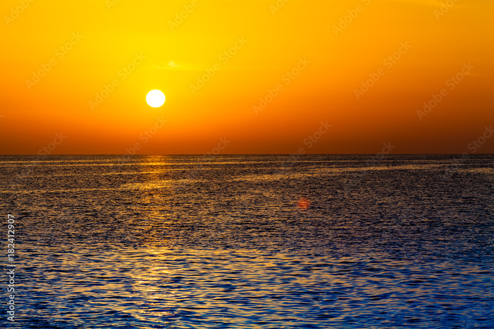 sunset over ocean. Sunset on the beach with beautiful sky. Dramatic sunset