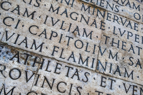 Latin inscription on the outside wall of Ara Pacis wall in Rome, Italy photo