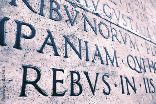 Latin inscription on the outside wall of Ara Pacis wall in Rome, Italy