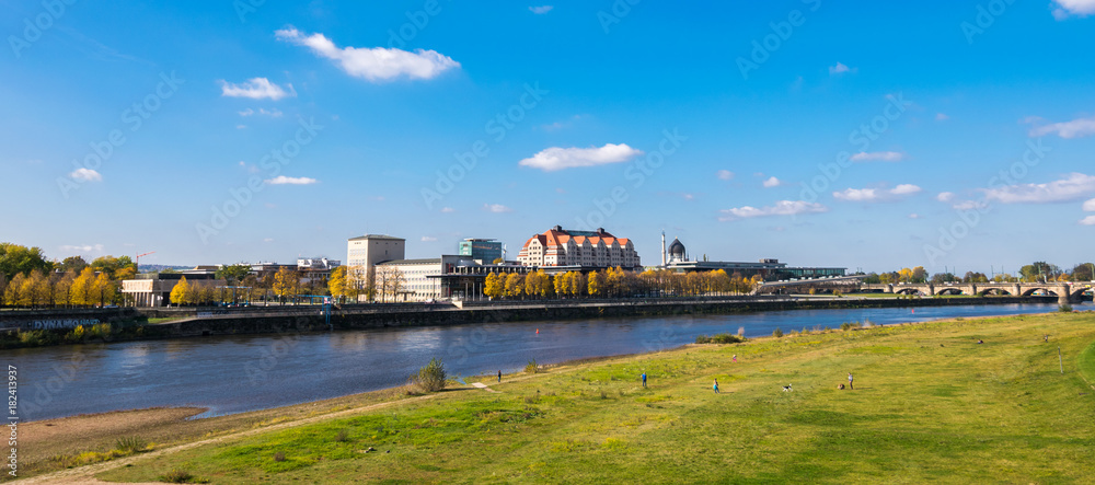 Scenic autumn view of Elbe river, Augustus Bridge and Old Town, Dresden, Saxony, Germany, Europe