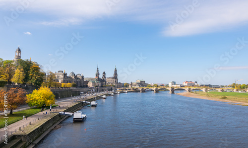 Scenic autumn view of Elbe river, Augustus Bridge and Old Town, Dresden, Saxony, Germany, Europe © Mada_cris