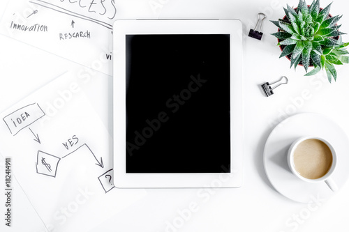 business plan development with tablet on desk background top vie