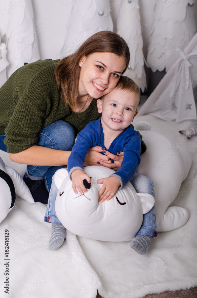 New Year in Scandinavian style, Mom with a child, children's toys New Year in Scandinavian style, Mom with a child, children's toys