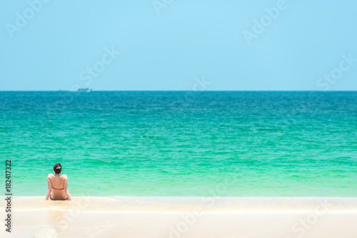 Beach vacation - Woman enjoy relaxing on the beach in Thailand