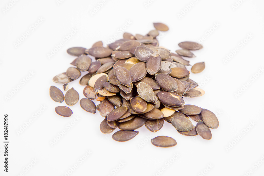 Pumpkin seeds on a white background Pumpkin seeds on a white background