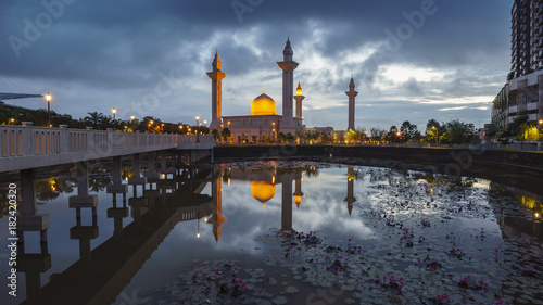 Beautiful scene of sunrise with reflection of Masjid Tengku Ampuan Jemaah, Bukit Jelutong, Shah Alam photo