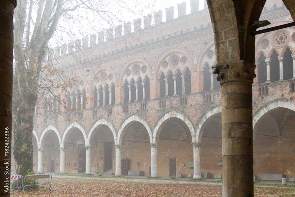Pavia, Italy. November 11 2017. Castello Visconteo (Visconteo castle) on a foggy day.