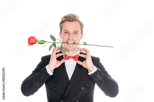 man in suit with rose flower