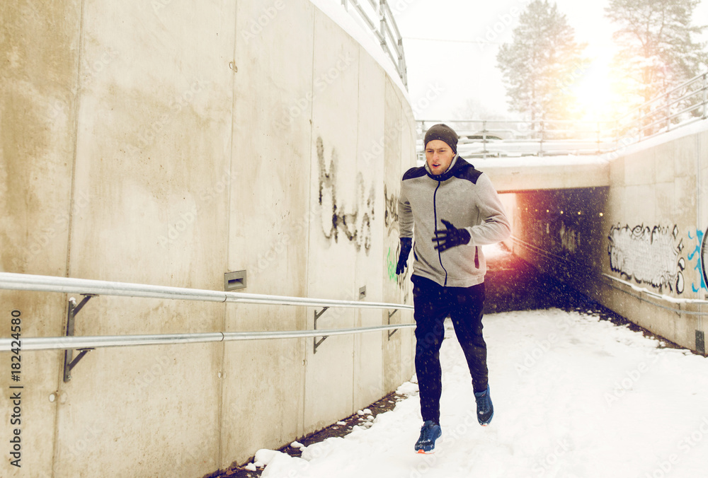 man running out of subway tunnel in winter man running out of subway tunnel in winter
