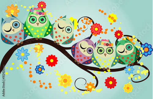 Bright cute cartoon owls sit on the flowering branches of fantastic trees