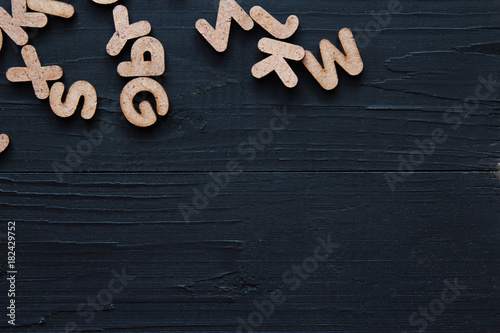 Close up wooden alphabet study english letters,ABC on the blackbroad as a background composition photo