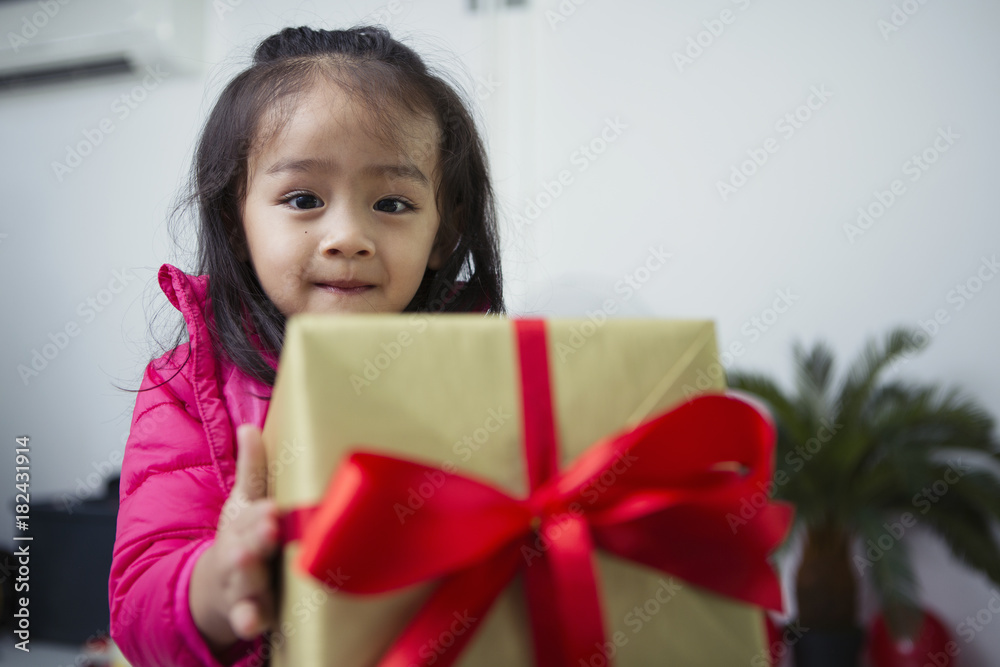 Cute girl holding gift boxes and smiling brightly. Cute girl holding gift boxes and smiling brightly.