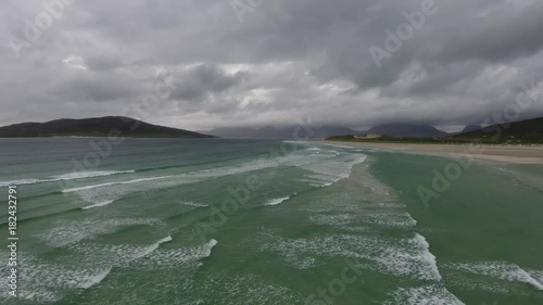 Stunning aerial schot on the Isle of Harris, Scotland, flying over turquoise water at seilebost beach photo