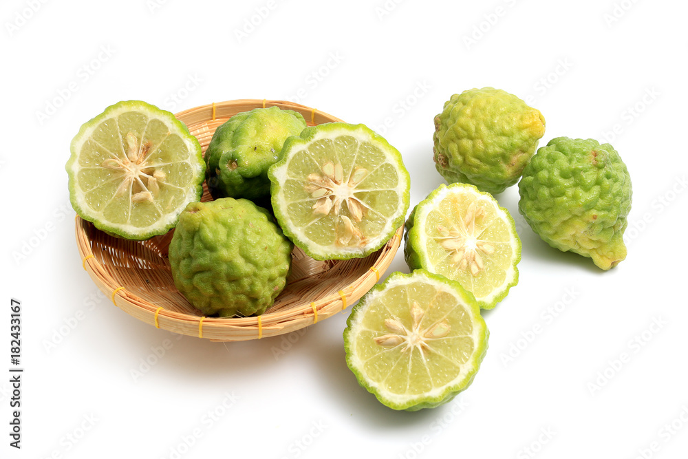 fresh bergamot fruit or the kaffir lime leaves in bamboo basket isolated on white background fresh bergamot fruit or the kaffir lime leaves in bamboo basket isolated on white background