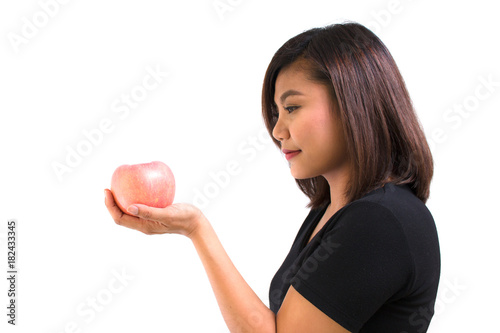 Young Asian woman holding light red apple on white background. Portrait of beautiful Asian woman holding light red apple for healthy eating diet concepts. healthy food concept. life style concept.