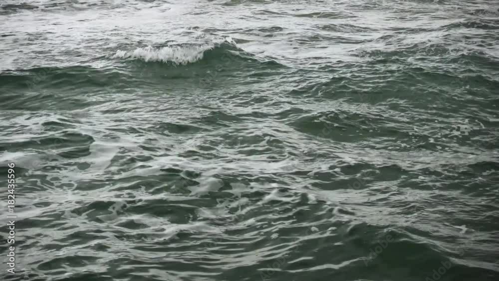 A little water swell with waves and foam on the surface A little water swell with waves and foam on the surface