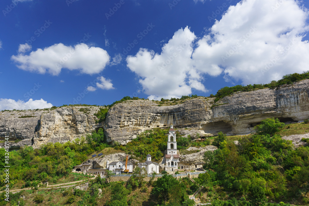 The largest in the Crimea by the number of inhabitants of the Holy Dormition cave Orthodox monastery located in the natural boundary of Mariam-Dere near Bakhchisarai.
