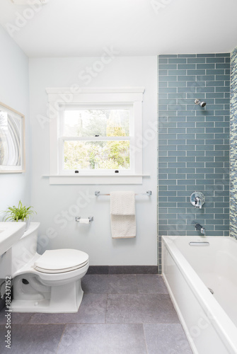 Modern bathroom with soft blue Mosaic glass tiles. 