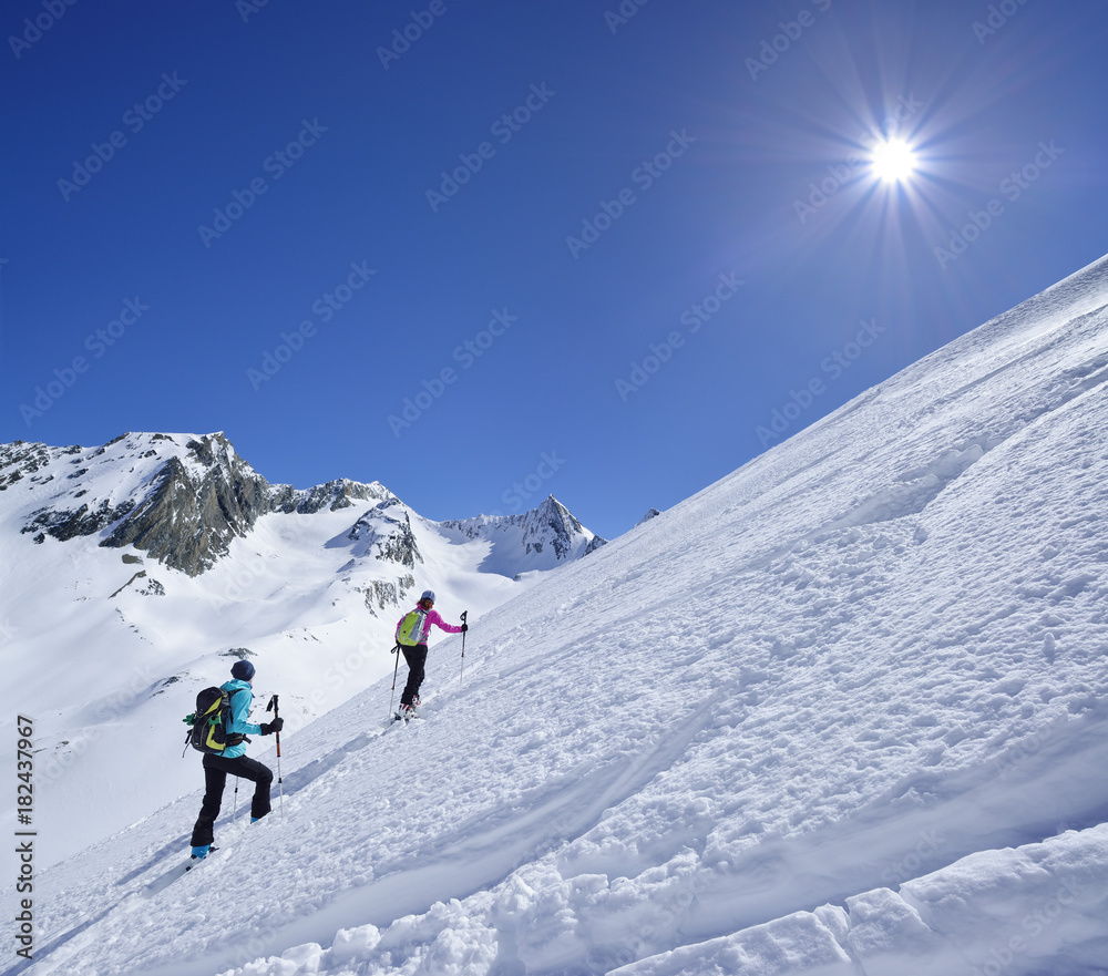 Two female back-country skiers ascending to Hinterer Seelenkogel, Obergurgl, Oetztal Alps, Tyrol, Austria Two female back-country skiers ascending to Hinterer Seelenkogel, Obergurgl, Oetztal Alps, Tyrol, Austria
