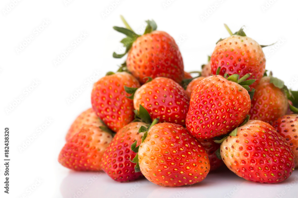 Fresh strawberries on white background. With copy space.