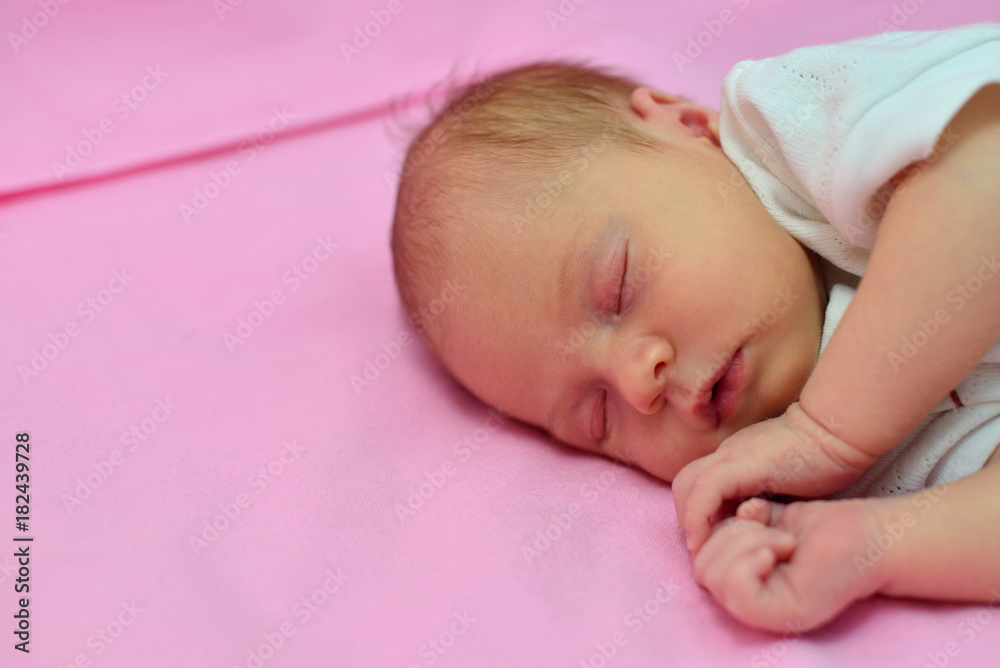 baby sleeping on the bed with ping background baby sleeping on the bed with ping background