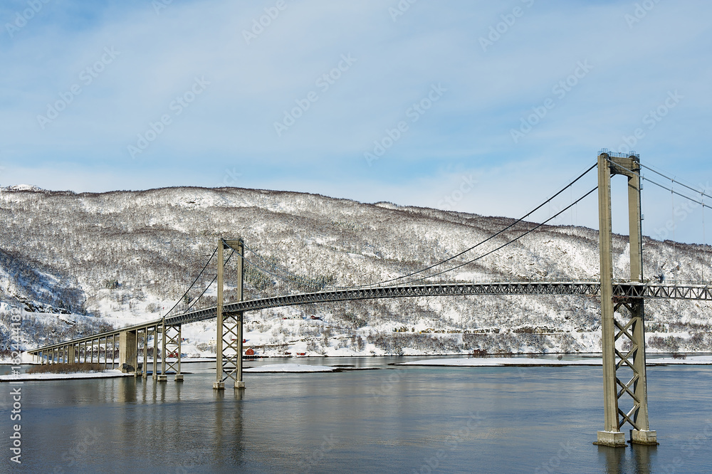 The Tjeldsund suspension road Bridge in winter crossing the Tjeldsundet ...