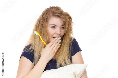 Sleepy happy woman hugging white pillow