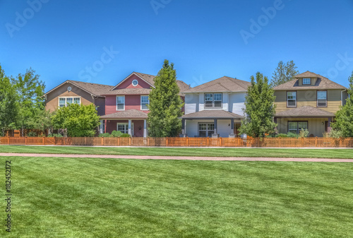 Fototapeta Naklejka Na Ścianę i Meble -  Neighborhood park with homes. 