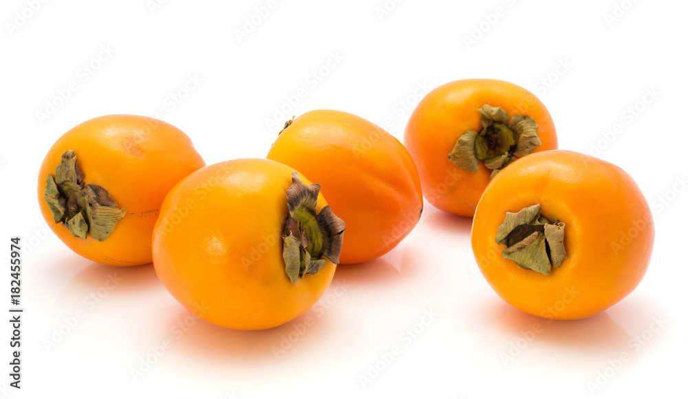 Persimmon Kaki isolated on white background five whole. Persimmon Kaki isolated on white background five whole.