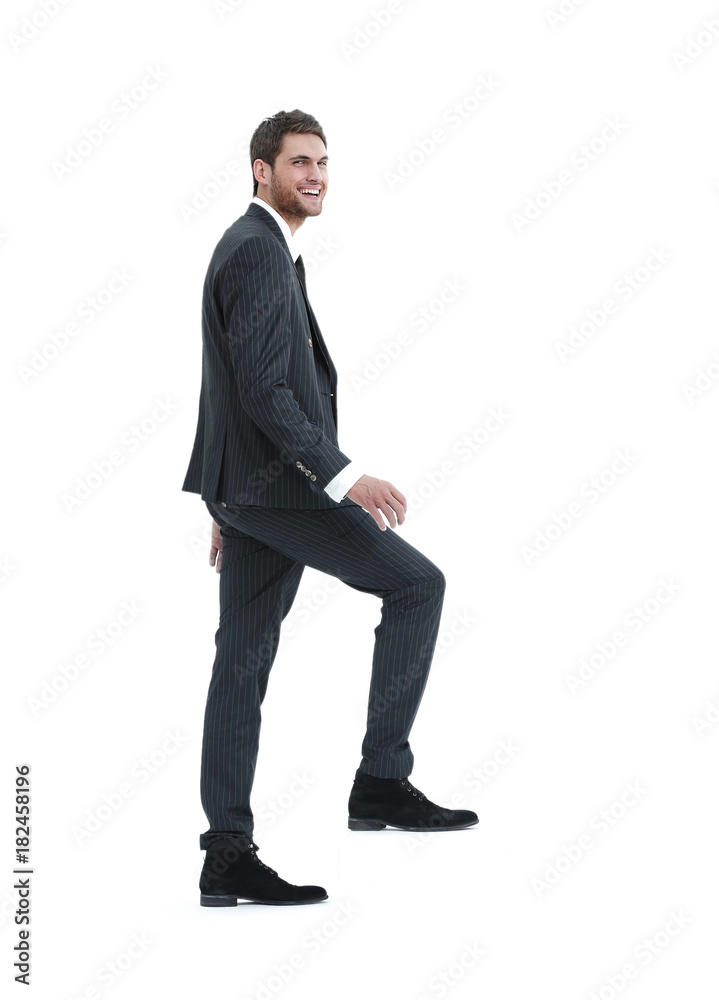 full growth.businessman taking a step forward.isolated on white. full growth.businessman taking a step forward.isolated on white.