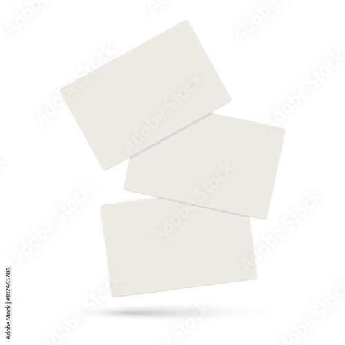 Three realistic blank plastic credit cards flying on a white background.