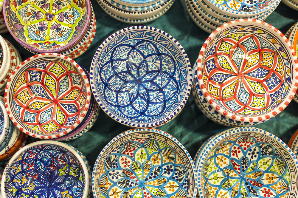 series of colorful hand painted Indian dishes