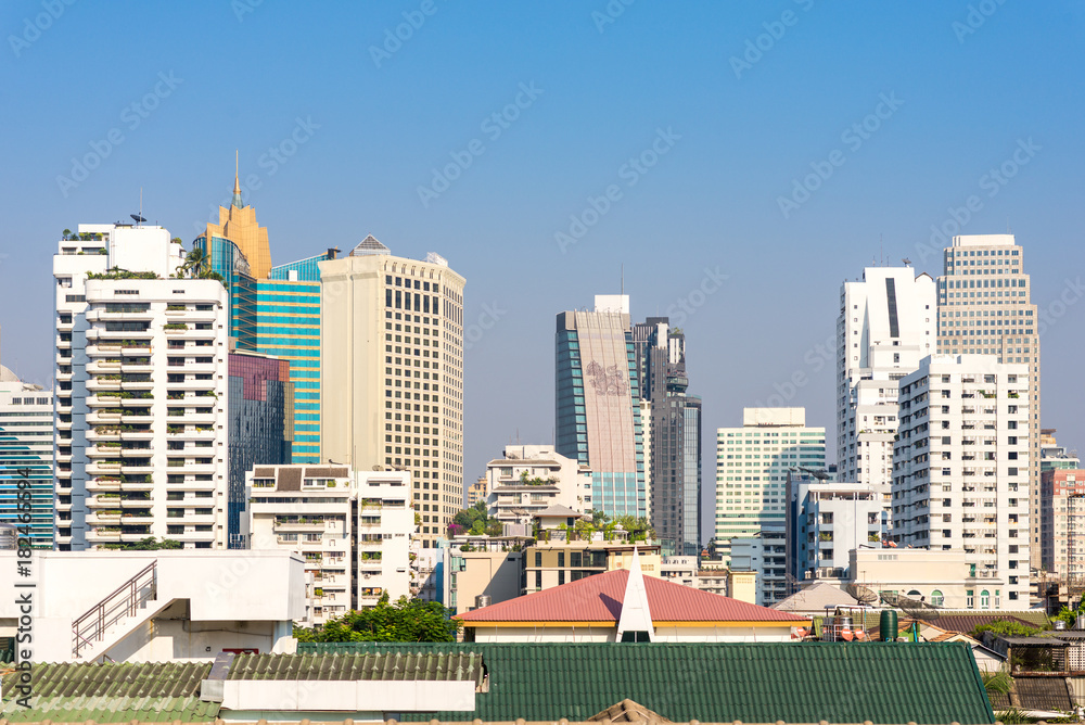 View to the skyline of the Watthana district in Bangkok. The business district with many tall buildings is situated at Sukhumvit road, which is one of the main roads in Bangkok and Thailand