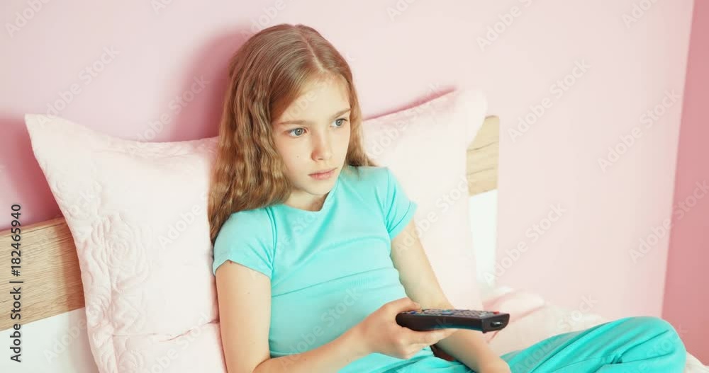 Child using TV remote control