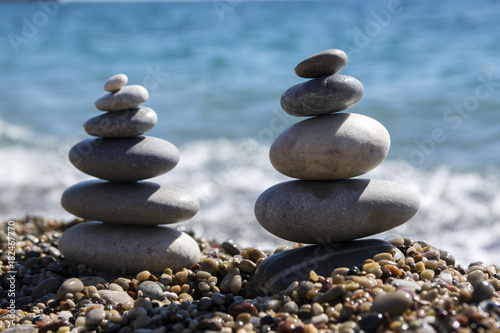 Stones and pebbles stack  harmony and balance  two stone cairns on seacoast