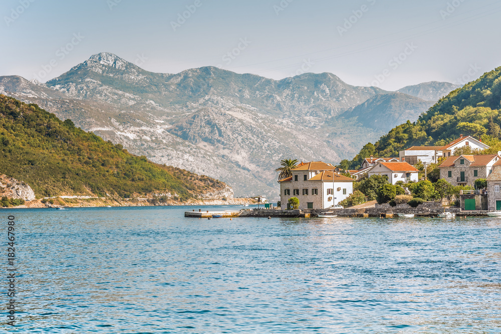 View on the coast from ferry transporting cars and people in Lepetane, Tivat, Montenegro.