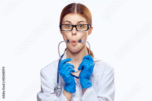 Young beautiful woman on white isolated background  emotions  doctor  medicine