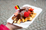 Traditional Belgian dessert - waffle with strawberry and cream. Brugge, Belgium